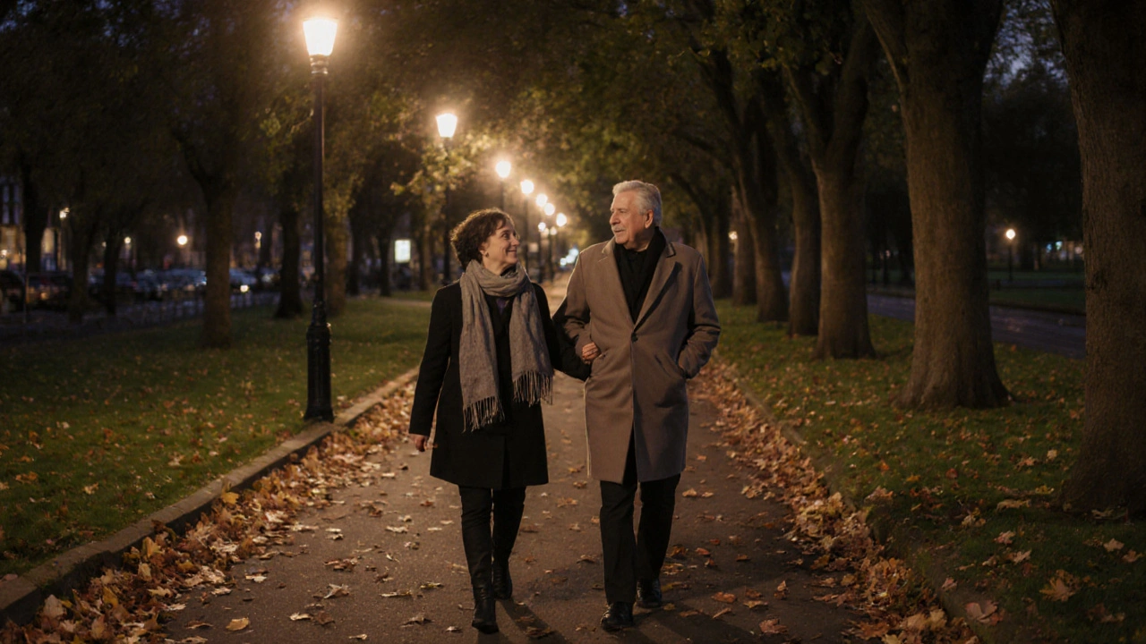 A couple walking peacefully along a tree-lined park path at dusk in Redbridge.